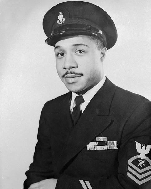 Alex Haley in Coast Guard Uniform. Original Caption reads: 'The United States Coast Guard has awarded the rating of Chief Journalist to Alex Haley, a...