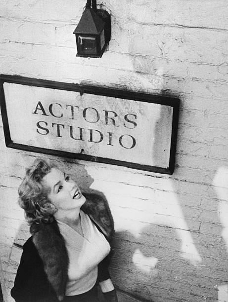 Marilyn Monroe, who yearns to do dramatic roles in Hollywood, stares open-mouthed at the sign outside the Actors Studio here December 4th. She paid a...