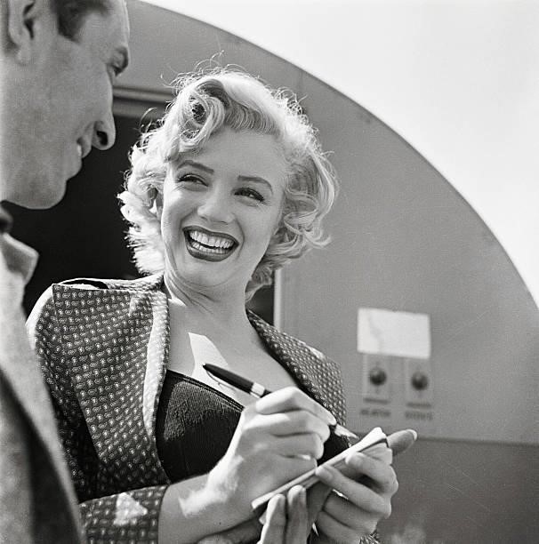 Marilyn Monroe Signing Autograph for Young Man