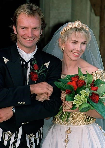 British rock star Sting holds his bride Trudie Styler prior to enter the church 22 August 1992 in Amesbury. The couple who married earlier 20 August,...