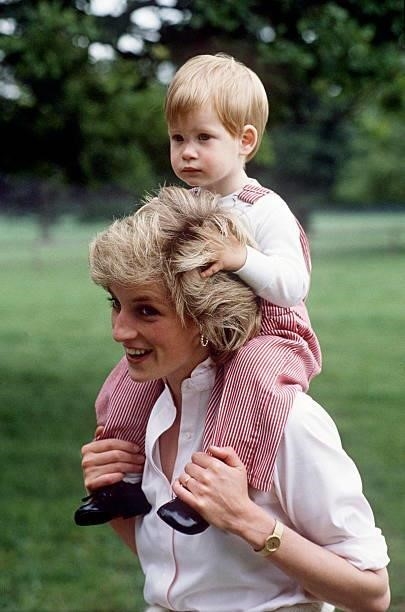 Princess Diana Carries Prince Henry On Her Shoulders At Highgrove.