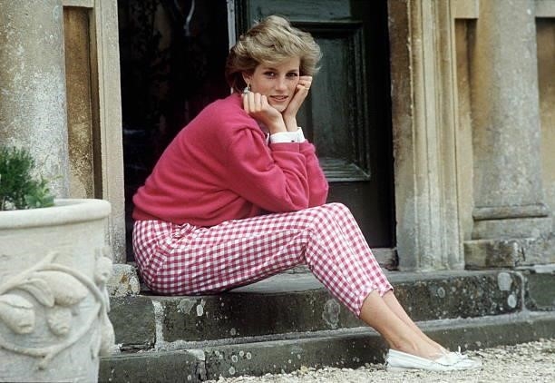 Diana, Princess of Wales sitting on a step at her home, Highgrove House, in Doughton, Gloucestershire, 18th July 1986.