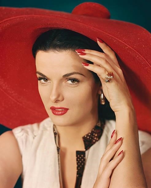 Jane Russell, left hand on forehead and right hand on left arm. Undated Portrait.