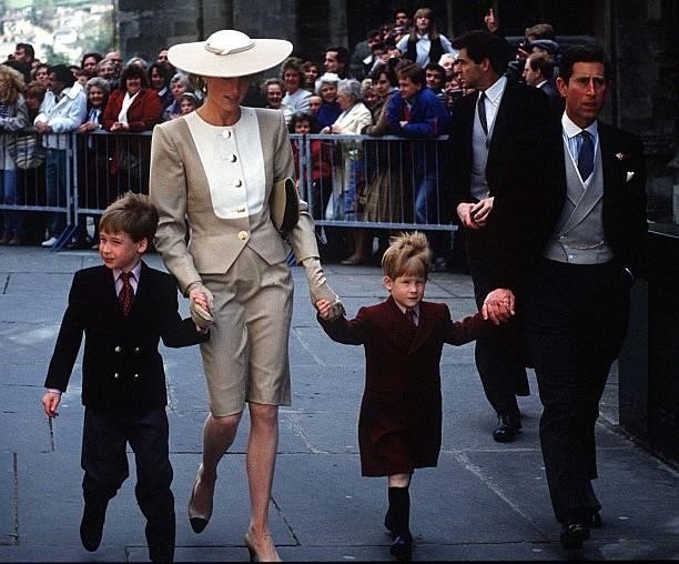 Prince William, Diana, Princess of Wales, Prince Harry and Charles, Prince of Wales, attend the wedding of the Duke of Hussey's daughter in May, 1989...