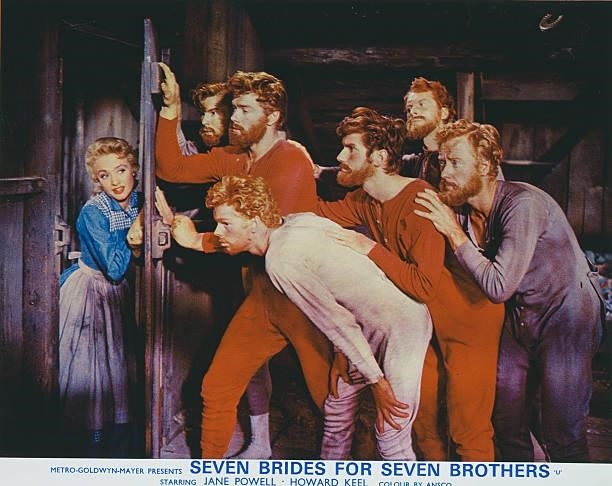 Actors Jane Powell and Russ Tamblyn appears on the poster for the MGM film 'Seven Brides For Seven Brothers', 1954.