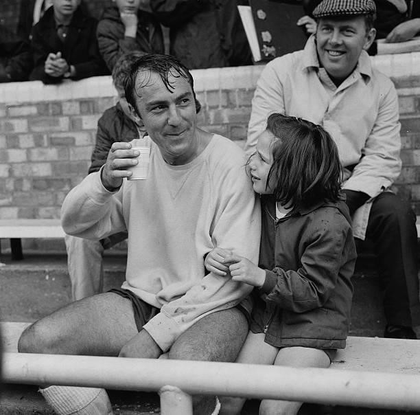 English footballer Jimmy Greaves of Tottenham Hotspur F.C. With his daughter Mitzi, 2nd August 1967.
