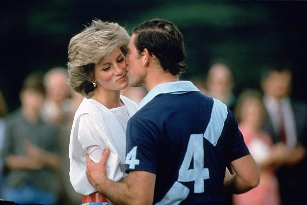 Prince Charles,The Prince of Wales kissing Princess Diana at prizegiving after a polo match at Cirencester.