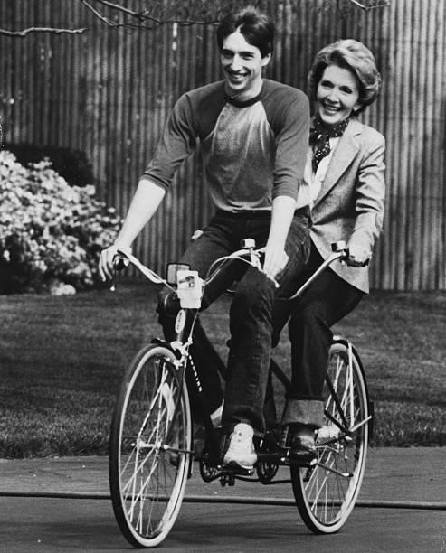 First Lady of the United States, Nancy Reagan , riding a tandem with her son Ron Jr in the South Grounds of the White House, Washington DC, May 1st...