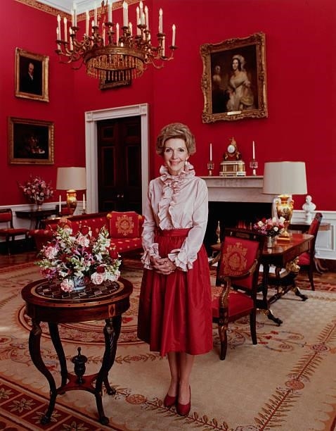 Official portrait of First Lady Nancy Reagan smiling in the White House, Washington DC, March 1981.