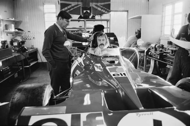 Footballer Jimmy Greaves in the cockpit of Jackie Stewart's Tyrrell 003, with Ken Tyrrell , UK, 1st December 1971.