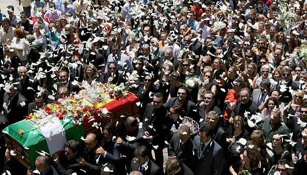 Flower petals rain down on the coffin of singer and actress Rocio Jurado, 02 June 2006 during her funeral procession in her home town of Chipiona,...