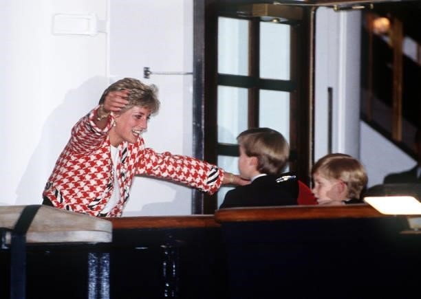 The Princess of Wales greets her sons Prince William and Prince Harry on the deck of the yacht Britannia in Toronto, when they joined their parents...