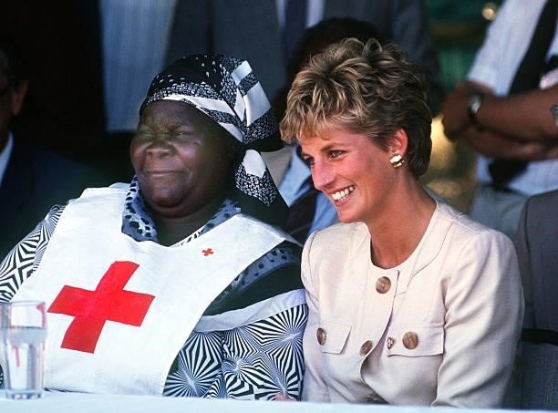 Princess Diana during a visit to the Red Cross borehole project for refugees in Zimbabwe, July 1993. She is wearing a safari suit by Catherine Walker.