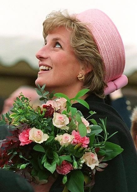 Princess Diana on a visit to the Queen's and Royal Hampshire Regiment at Howe Barracks, Canterbury, Kent, May 1995. She is wearing a hat by Philip...