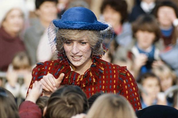 Princess Diana wearing a Bellville Sassoon coat and John Boyd hat during a visit to Wrexham, Wales, November 1982.