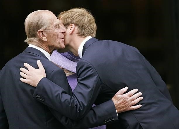 Prince William greets his grandfather Prince Philip, Duke of Edinburgh at the 10th Anniversary Memorial Service for their mother Diana, Princess of...