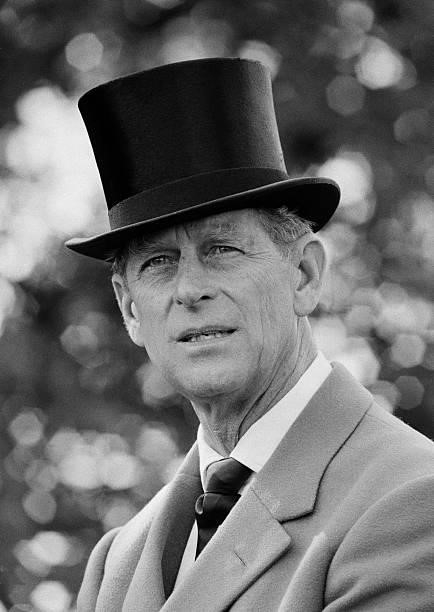 Prince Phillip, wearing a top hat at a carriage driving event, England, 1983.