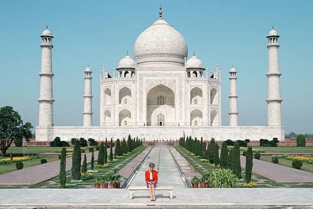 Diana Princess of Wales sits in front of the Taj Mahal during a visit to India