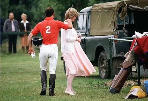 Prince Charles, Prince of Wales walks with his arm around his pregnant wife Diana, Princess of Wales at polo in Windsor just days before the birth of...