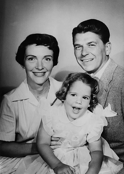 American actor and future president, Ronald Reagan with his wife Nancy and daughter Patti, in May 1957, the year Reagan was voted “Screen Father of...