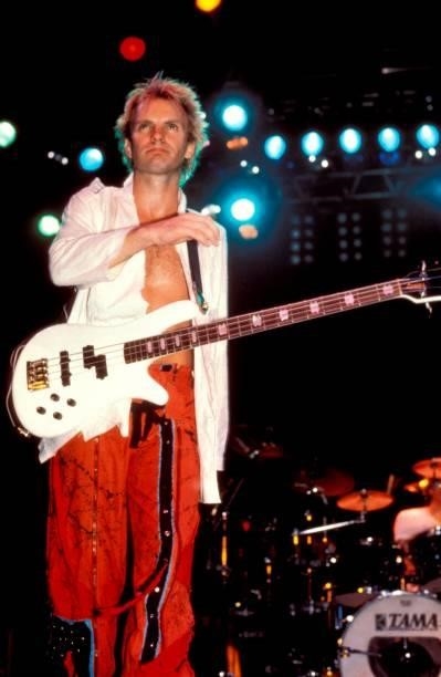 Photo of POLICE and STING, Sting performing live onstage, playing Spector NS-2 bass