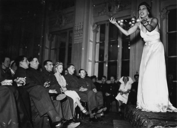 American-born French entertainer Josephine Baker performs for troops at the British Leave Club at the Hotel Moderne in Paris, World War II, May 1940.