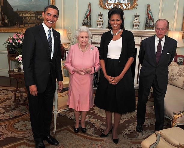 President Barack Obama and his wife, Michelle Obama talk with Queen Elizabeth II and Prince Philip, Duke of Edinburgh at a reception at Buckingham...