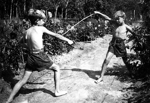 Young Jean-Paul Belmondo with his brother Alain playing in Clairefontaine, c. 1940