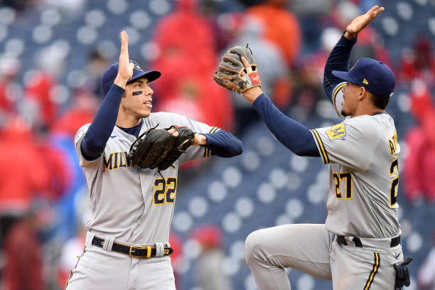 WASHINGTON, DC - MAY 30: Christian Yelich #22 and Willy Adames #27 of the Milwaukee Brewers celebrate after defeating the Washington Nationals at Nationals Park on May 30, 2021 in Washington, DC.